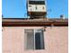 Close up exterior of the home, with window and air conditioning unit on the roof at 6741 Solaron Ave, Las Vegas, NV 89156