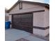 Two car garage with a dark brown garage door at 6741 Solaron Ave, Las Vegas, NV 89156