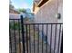 Side yard access through a metal gate at 6741 Solaron Ave, Las Vegas, NV 89156