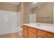 Bathroom features a white vanity top, oak cabinets, and tile surround tub at 700 Carnegie St # 3711, Henderson, NV 89052