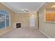 Living room showcasing fireplace, neutral walls, and a view into the kitchen at 700 Carnegie St # 3711, Henderson, NV 89052