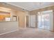 Open-concept living room view into kitchen with breakfast bar and laundry area at 700 Carnegie St # 3711, Henderson, NV 89052