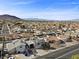 This aerial view showcases the property's location within a neighborhood, set against a backdrop of mountains at 714 Arrowhead Trl, Henderson, NV 89002