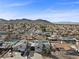 Aerial view of neighborhood showcasing the property's location with mountain views at 714 Arrowhead Trl, Henderson, NV 89002