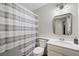 Cozy bathroom featuring a shower with modern vanity and neutral color palette at 714 Arrowhead Trl, Henderson, NV 89002