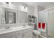 Bathroom featuring a double vanity, walk-in shower, and modern fixtures at 714 Arrowhead Trl, Henderson, NV 89002