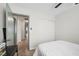 Bedroom with ceiling fan, carpet, white bedding, and a gray door at 714 Arrowhead Trl, Henderson, NV 89002