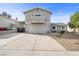 Inviting two-story home with spacious driveway, manicured gravel landscaping, and an attached two-car garage at 714 Arrowhead Trl, Henderson, NV 89002