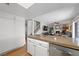 Open floor plan kitchen featuring white cabinets and stainless appliances at 714 Arrowhead Trl, Henderson, NV 89002