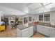 Bright kitchen with stainless steel appliances open to living room at 714 Arrowhead Trl, Henderson, NV 89002