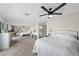 Large main bedroom featuring carpet, ceiling fan, and mirrored closet doors at 714 Arrowhead Trl, Henderson, NV 89002