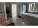 Bathroom featuring a soaking tub with tiled surround at 7511 Shadow Estates Way, Las Vegas, NV 89113