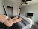 Bedroom featuring a bed with a teddy bear, closet and a TV at 7511 Shadow Estates Way, Las Vegas, NV 89113