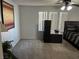 Spacious bedroom with natural light, modern furniture and a decorative art piece on the wall at 7511 Shadow Estates Way, Las Vegas, NV 89113