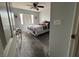 Bedroom with ceiling fan and window with blinds for natural light at 7511 Shadow Estates Way, Las Vegas, NV 89113