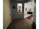 Front door leading to an entryway with a view into a living room and staircase at 7511 Shadow Estates Way, Las Vegas, NV 89113