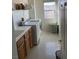 Laundry room with built in sink, cabinets and washer and dryer at 7511 Shadow Estates Way, Las Vegas, NV 89113