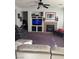 Bright living room featuring a fireplace and built-in entertainment center at 7511 Shadow Estates Way, Las Vegas, NV 89113