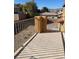 Private patio with a view of the backyard and surrounding landscape at 7511 Shadow Estates Way, Las Vegas, NV 89113