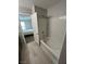 Bathroom with a white shower and view of the main bedroom providing a serene retreat at 7732 Hand Woven Ct, Las Vegas, NV 89149