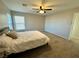 Spacious bedroom featuring neutral tones and a ceiling fan for comfortable living at 7732 Hand Woven Ct, Las Vegas, NV 89149