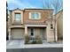 Charming two-story home with a front porch and attached garage, offering curb appeal and convenience at 7732 Hand Woven Ct, Las Vegas, NV 89149