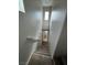 Upstairs hallway with view to bathroom and upper level at 7732 Hand Woven Ct, Las Vegas, NV 89149