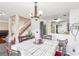 Bright dining area with table and chairs, view of kitchen and staircase at 7987 Cina Ave, Las Vegas, NV 89147