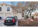 Front view of house with a car parked in driveway at 7987 Cina Ave, Las Vegas, NV 89147