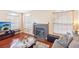 Living room with hardwood floors and fireplace at 7987 Cina Ave, Las Vegas, NV 89147