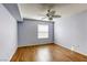 Bright bedroom with ceiling fan and wood-look flooring at 8101 W Flamingo Rd # 1157, Las Vegas, NV 89147