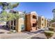 Two-story building with tan and orange exterior, balconies, and stairs at 8101 W Flamingo Rd # 1157, Las Vegas, NV 89147