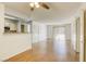 Bright living room with wood-look floors and access to kitchen at 8101 W Flamingo Rd # 1157, Las Vegas, NV 89147