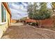 Landscaped backyard with fire pit and seating at 825 Great Sky Ct, North Las Vegas, NV 89084