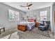 Bright bedroom with a queen-size bed and ceiling fan at 825 Great Sky Ct, North Las Vegas, NV 89084