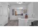 Bright entryway with tile flooring, showing views into the living room and a glimpse of a sitting area at 825 Great Sky Ct, North Las Vegas, NV 89084