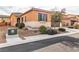 Single story house with tan exterior and two car garage at 825 Great Sky Ct, North Las Vegas, NV 89084