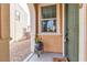 Front door entrance with arched entryway and potted plant at 825 Great Sky Ct, North Las Vegas, NV 89084