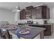 Spacious kitchen with granite countertops and dark wood cabinets at 825 Great Sky Ct, North Las Vegas, NV 89084