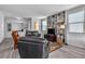 Comfortable living room with leather furniture and built-in shelves at 825 Great Sky Ct, North Las Vegas, NV 89084