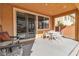 Covered patio with seating area, perfect for outdoor dining at 825 Great Sky Ct, North Las Vegas, NV 89084