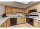 Efficient kitchen layout with essential appliances, ample cabinet space, and a skylight at 9070 Spring Mountain Rd # 113, Las Vegas, NV 89117