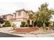 Charming two-story home with a well-maintained yard, a two-car garage, and mature landscaping at 10127 Capistrello Ave, Las Vegas, NV 89147