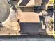 Birds-eye view of a roof showcasing its architecture, color, and design, with a driveway and simple landscaping at 1056 Flatfoot Ave, Henderson, NV 89012