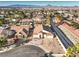 An aerial view of the home and surrounding neighborhood featuring mature landscaping, and mountain views at 1056 Flatfoot Ave, Henderson, NV 89012