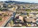 An aerial view of the home and surrounding neighborhood featuring mature landscaping, and nearby community areas at 1056 Flatfoot Ave, Henderson, NV 89012