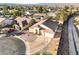 An aerial view of the home, landscaping, and surrounding neighborhood featuring mature landscaping, and mountain views at 1056 Flatfoot Ave, Henderson, NV 89012