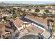 An aerial view of the home and neighborhood featuring mature landscaping, and mountain views at 1056 Flatfoot Ave, Henderson, NV 89012