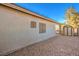 Exterior backyard view with a storage shed and low-maintenance gravel landscaping at 1056 Flatfoot Ave, Henderson, NV 89012