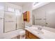 Bathroom featuring a shower over tub, neutral color scheme, and a spacious vanity at 1056 Flatfoot Ave, Henderson, NV 89012
